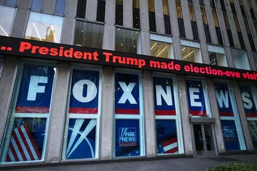 A headline about President Donald Trump is displayed outside Fox News studios, on Nov. 28, 2018, in New York. Attorneys for the cable news giant argued in a counterclaim unsealed, Thursday, Feb. 16, 2023, that a $1.6 billion defamation lawsuit against Fox News by Dominion Voting Systems over the network’s coverage of the 2020 presidential election is an assault on the First Amendment. (AP Photo/Mark Lennihan, File)