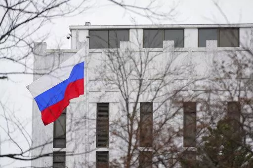 The Russian flag flies outside the Embassy of Russia in Washington, Feb. 24, 2022. The United States and allies are stepping up sanctions against Russia over its invasion of Ukraine.  (AP Photo/Patrick Semansky, File)
