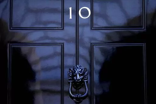 The door to 10 Downing Street in London, Friday, July 8, 2022. Under Britain's parliamentary system, the public never actually votes for its prime minister. Instead, voters tick the box for a representative from their local area, who then becomes one of Britain’s 650 Members of Parliament. The party that wins a majority forms a government and puts their leader into the prime minister's seat. (AP Photo/Frank Augstein, File)