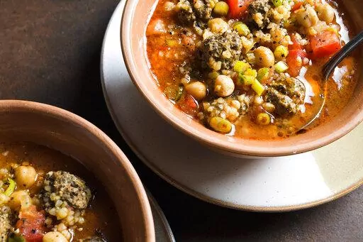 This image released by Milk Street shows a recipe for North African Lamb Chickpea and Bulgur Soup. (Milk Street via AP)