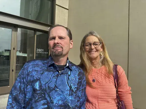 Richard Rogers and his wife Laurie stand outside the James F. Battin Federal Courthouse, Tuesday, Oct. 1, 2024, in Billings, Mont. (AP Photo/Matthew Brown, File)
