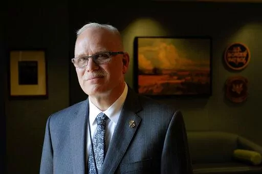 U.S. Customs and Border Protection Commissioner Chris Magnus poses for a photograph during an interview in his office with The Associated Press, Tuesday, Feb. 8, 2022, in Washington. A strained Border Patrol is getting increased attention from the Biden administration after tense meetings between senior officials and the rank-and-file while the agency deals with one of the largest spikes in migration along the U.S.-Mexico border in decades. Department of Homeland Security Secretary Alejandro May
