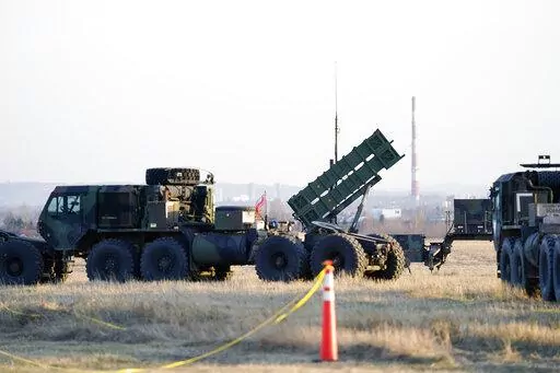 Patriot missles are seen at the Rzeszow-Jasionka Airport, March 25, 2022, in Jasionka, Poland, as President Joe Biden arrives to board Air Force One enroute to Warsaw, Poland. U.S. officials say the Biden administration is poised to approve sending a Patriot missile battery to Ukraine, finally agreeing to an urgent request from Ukrainian leaders desperate for more robust weapons to shoot down incoming Russian fire. (AP Photo/Evan Vucci, File)