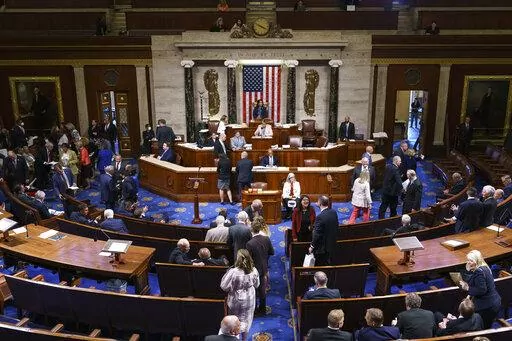 FILE - Members of the House of Representatives gather in the chamber to vote on creation of a select committee to investigate the Jan. 6 Capitol insurrection, at the Capitol in Washington, on June 30, 2021. (AP Photo/J. Scott Applewhite, File)