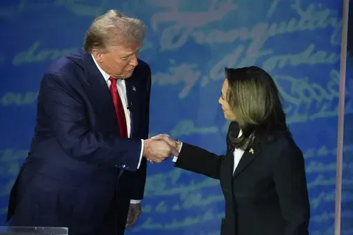Republican presidential nominee former President Donald Trump and Democratic presidential nominee Vice President Kamala Harris shake hands before the start of an ABC News presidential debate at the National Constitution Center, Sept. 10, 2024, in Philadelphia. (AP Photo/Alex Brandon, file)