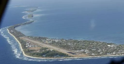 Funafuti, the main island of the nation state of Tuvalu, is photographed on Oct. 13, 2011, from a Royal New Zealand Air Force C130 aircraft as it approaches the tiny South Pacific nation. Tuvalu lawmakers chose Feleti Teo as the tiny South Pacific island nation's prime minister Monday, Feb. 26, 2024, after elections a month ago ousted the last government leader. (AP Photo/Alastair Grant, File)