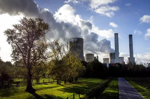 Steam rises from the coal-fired power plant Niederaussem, Germany, on Nov. 2, 2022. Researchers say efforts to remove carbon dioxide from the atmosphere aren't being scaled up fast enough and can’t be relied on to meet crucial climate goals. A report published Thursday by scientists in Europe and the United States found that new methods of CO2 removal currently account for only 0.1% of the 2 billion metric tons sucked from the atmosphere each year. (AP Photo/Michael Probst, File)