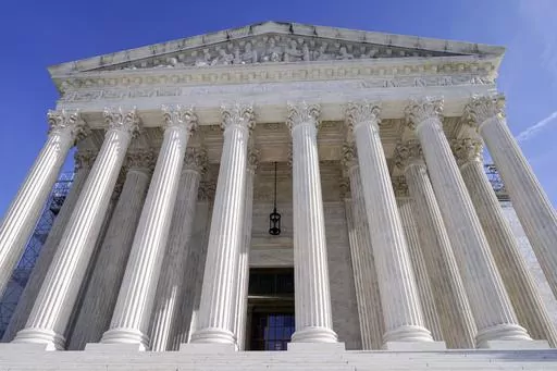 The U.S Supreme Court is photographed, Jan. 3, 2024, in Washington. The Supreme Court on Tuesday left in place the admissions policy at an elite public high school in Virginia, despite claims that it discriminates against highly qualified Asian Americans. (AP Photo/Mariam Zuhaib, file)