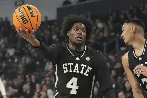Mississippi State forward Cameron Matthews (4) pulls down an offensive rebound during the first half of an NCAA college basketball game against Pittsburgh, Wednesday, Dec. 4, 2024, in Starkville, Miss. (AP Photo/Rogelio V. Solis)