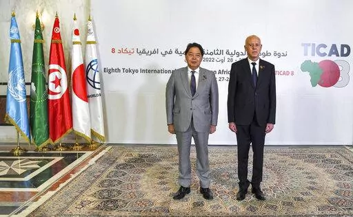 Tunisia's President Kais Saied, right, and Japan's Foreign Minister Yoshimasa Hayashi pose for a photo during the eighth Tokyo International Conference on African Development (TICAD) in Tunisia's capital Tunis on Saturday, Aug. 27, 2022. African heads of state, representatives of international organizations and private business leaders are in Tunisia this weekend for the eighth iteration of the Tokyo International Conference on African Development, a triennial event launched by Japan to promote 