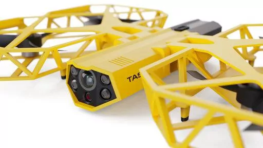 This photo provided by Axon Enterprise depicts a conceptual design through a computer-generated rendering of a taser drone. Taser developer Axon says it is working to build drones armed with the electric stunning weapons that could fly in schools and “help prevent the next Uvalde, Sandy Hook, or Columbine.” But its own technology advisers quickly panned the idea as a dangerous fantasy.  (Axon Enterprise, Inc. via AP)