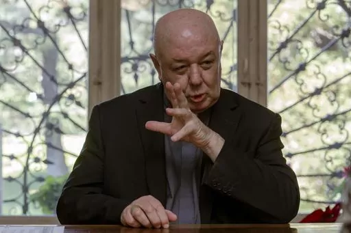 Prefect of the Archivio Apostolico Vaticano, Bishop Sergio Pagano speaks in his office at The Vatican, Wednesday, Feb. 14, 2024, during an interview with The Associated Press. In a new book-length interview with Italian journalist Massimo Franco, “Secretum”, Pagano divulges some of the unknown or behind-the-scenes details of well-known sagas of the Holy See and its relations with the outside world over the past 12 centuries. From Napoleon’s sacking of the archive in 1810 to the Galileo aff