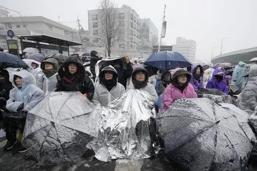 Supporters of impeached South Korean President Yoon Suk Yeol attend a Sunday service as they gather to oppose his impeachment near the presidential residence in Seoul, South Korea, Sunday, Jan. 5, 2025. (AP Photo/Ahn Young-joon)