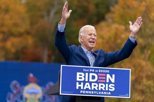 Democratic presidential candidate former Vice President Joe Biden speaks at a drive-in campaign stop at Bucks County Community College in Bristol, Pa., Oct. 24, 2020. Biden and his allies hope big recent wins on climate, health care and more will at least temporarily tamp down questions among top Democrats about whether he will run for reelection. (AP Photo/Andrew Harnik, File)