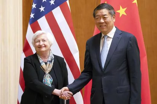 Treasury Secretary Janet Yellen, left, shakes hands with Chinese Vice Premier He Lifeng during a meeting at the Diaoyutai State Guesthouse in Beijing, China, July 8, 2023. The U.S. Treasury Department and China's Ministry of Finance launched a pair of economic working groups on Friday in an effort to ease tensions and deepen ties between the nations. (AP Photo/Mark Schiefelbein, Pool, File)