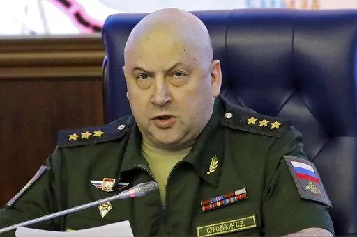 Colonel General Sergei Surovikin, Commander of the Russian forces in Syria, speaks, with a map of Syria projected on the screen in the back, at a briefing in the Russian Defense Ministry in Moscow, Russia, June 9, 2017. Surovikin has become the face of Russia’s new strategy in Ukraine, which includes unleashing a barrage of strikes against the country's infrastructure. (AP Photo/Pavel Golovkin, File)