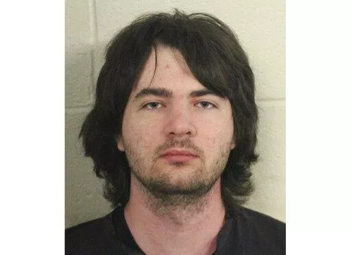 This photo provided by Floyd County, Ga., Police shows Robert Keith Tincher III.  Police say Tincher killed his grandmother by stuffing her in a freezer while she was still alive. Floyd County Police discovered the body of Doris Cumming, 82, late Thursday, April 14, 2022,  in the Armuchee home she shared with her grandson, 29-year-old Robert Keith Tincher III.(Floyd County, GA., Police via AP)