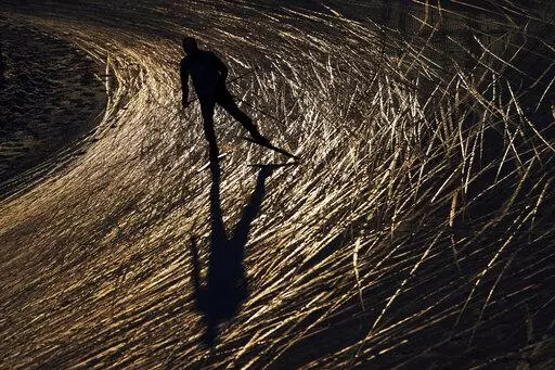 A skier trains during a cross-country skiing training session at the 2022 Winter Olympics, Monday, Feb. 14, 2022, in Zhangjiakou, China. (AP Photo/John Locher)