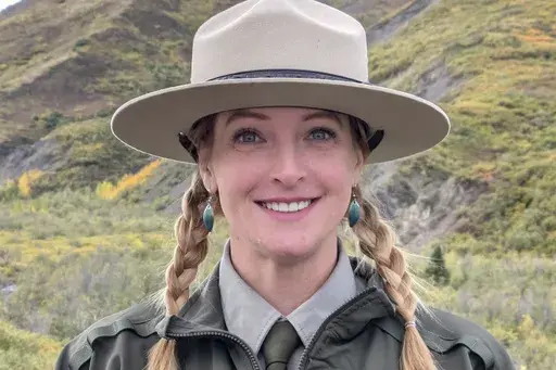 This photo provided by Kristin Jenn shows her in her National Park Service ranger uniform in Denali National Park and Preserve in Alaska in October 2024, while she was a seasonal worker for the NPS. (Kristin Jenn via AP)