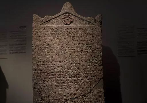 The Heliodorus Stele, loaned by American billionaire Michael Steinhardt, is displayed at the Israel Museum in Jerusalem, Wednesday, Jan. 5, 2022. Last month, Steinhardt surrendered the artifact, along with 179 others valued at roughly $70 million, as part of a landmark deal with the Manhattan District Attorney's office to avoid prosecution. Eight Neolithic masks loaned by Steinhardt to the Israel Museum for a major exhibition in 2014 were also seized as part of the billionaire's deal with New Yo