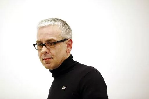 Russian businessman Dmitry Kovtun arrives for a news conference at Interfax headquarters in Moscow, Russia, Wednesday, April 8, 2015. Russian agent Kovtun, who was accused by the U.K. authorities in the poisoning death of former spy Alexander Litvinenko in London in 2006, died Saturday, June 4, 2022, at age 57. (AP Photo/Pavel Golovkin, File)