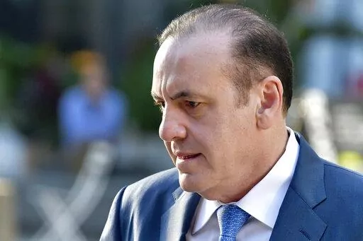 FILE— Gamal Abdelaziz arrives at federal court for his trial, Thursday, Oct. 7, 2021, in Boston. Abdelaziz, a former casino executive from Las Vegas who was found guilty in his college admissions bribery trial, is scheduled to be sentenced on Wednesday Feb. 9, 2022. (AP Photo/Josh Reynolds, File)