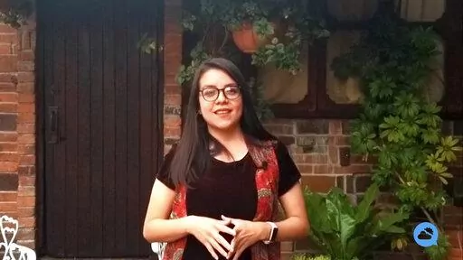 In this screen grab from a video provided by the Meteored Press Office, meteorologist Martha Llanos Rodriguez gives an on camera weather report in Mexico City.  The storm-chasing meteorologist of Mexico City died in a crash on on Interstate 90 in southwest Minnesota, on Wednesday, May 11, that authorities said was caused by downed power lines as severe storms brought damaging winds, heavy rain and a few reports of tornadoes. (Meteored Press Office via AP)