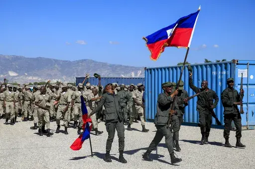New members of the Armed Forces of Haiti celebrate after their graduation ceremony in Port-au-Prince, Haiti, Thursday, Dec. 22, 2022. (AP Photo/Odelyn Joseph, File)
