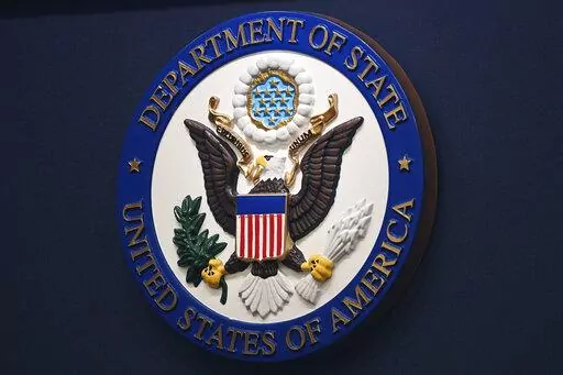 The State Department seal is seen on the briefing room lectern at the State Department in Washington, Jan. 31, 2022. Everyday Americans will be able to help refugees adjust to life in the U.S. in a program being launched by the State Department. The goal is to give private citizens a role in resettling the thousands of refugees who come to America every year. The State Department is calling the new program the Welcome Corps.(Mandel Ngan, Pool via AP, File)