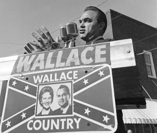 Alabama Gov. George C. Wallace gestures as he makes an election campaign speech for his wife, Lurleen, Nov. 8, 1966, in Wetumpka, Ala. Republican presidential candidates will debate Wednesday, Dec. 6, 2023, within walking distance of where Wallace staged his “stand in the schoolhouse door” to oppose the enrollment of Black students at the University of Alabama during the Civil Rights Movement. (AP Photo/LG, File)