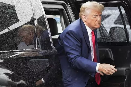 Former President Donald Trump arrives to board his plane at Ronald Reagan Washington National Airport, Aug. 3, 2023, in Arlington, Va., after facing a judge on federal conspiracy charges that allege he conspired to subvert the 2020 election. Trump and his legal team face long odds in their bid to move his 2020 election conspiracy trial out of Washington. They argue the Republican former president can’t possibly get a fair trial in the overwhelmingly Democratic nation’s capital. (AP Photo/Ale