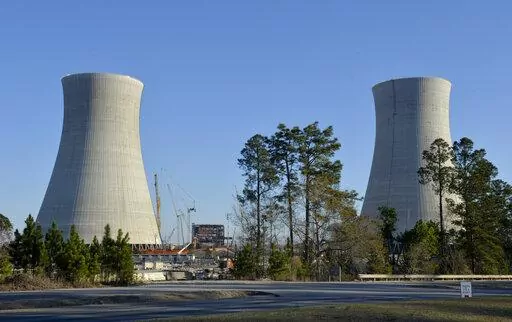 The cooling towers of two new nuclear reactors at Plant Vogtle in Waynesboro, Ga., are pictured Friday, March 22, 2019. The U.S. Nuclear Regulatory Commission announced Wednesday, Aug. 3, 2022, that it had approved plans to load radioactive fuel into one of the new reactors, which could clear the way for the first new nuclear power plant built in the United States in decades to come online by March 2023. (Michael Holahan/The Augusta Chronicle via AP, File)