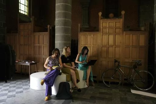 Confessional booths are stacked into a corner at the Sacred Heart church in Mechelen, Beligum, Monday, June 19, 2023. Across Europe, the continent that nurtured Christianity for most of two millennia, many churches, convents, beguinages and chapels stand empty as faith and church attendance have dwindled over the past half century. Many are now been repurposed to preserve their historical and architectural relevance, while others have opened up to non-religious activities to expand their use. (A