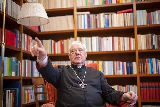 German Cardinal Gerhard Mueller speaks during an interview with The Associated Press in his apartment in Rome, Wednesday, Jan. 4, 2023. Benedict gave his fellow German theologian his old job, as prefect of the Vatican’s doctrine office. He entrusted his life’s theological works to Mueller, who has spent nearly two decades organizing them in a 16-volume, 25,000-page opus along the lines of Thomas Aquinas’ Summa Theologica. He gave him his old flat on the top floor of a Vatican apartment bui