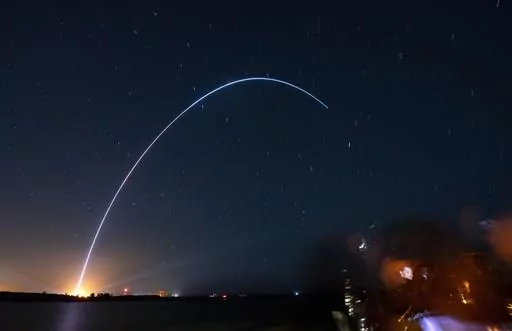 Spectators at Jetty Park in Cape Canaveral, Fla., watch as Terran I, a 3D-printed rocket by Relativity Space, lifts off from Cape Canaveral Space Force Station late Wednesday, March 22, 2023. (Craig Bailey/Florida Today via AP)