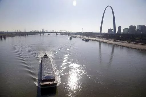 A barge powers its way up the Mississippi River on Nov. 16, 2012, in St. Louis. Parts of the Mississippi River are so low from weeks of drought that barge traffic is being limited at the worst possible time: as crop harvests begin in 2022. (AP Photo/Jeff Roberson, File)