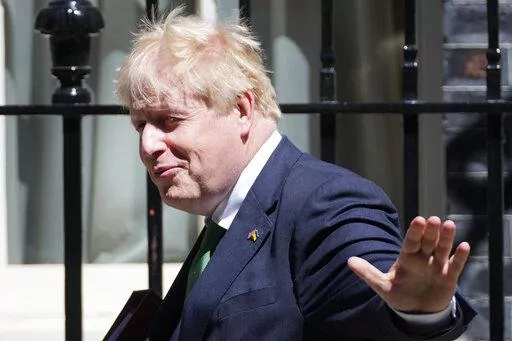 Britain's Prime Minister Boris Johnson leaves 10 Downing Street to attend the weekly Prime Ministers' Questions session in parliament in London, Wednesday, June 8, 2022. (AP Photo/Frank Augstein)