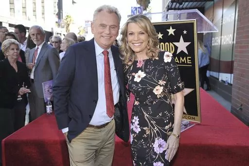 Pat Sajak, left, and Vanna White, from "Wheel of Fortune," attend a ceremony honoring Harry Friedman with a star on the Hollywood Walk of Fame on Nov. 1, 2019, in Los Angeles. Sajak is taking one last spin on “Wheel of Fortune," announcing Monday, June 12, 2023, that its upcoming season will be his last as host. (Photo by Richard Shotwell/Invision/AP, File)