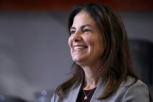 Republican gubernatorial candidate Kelly Ayotte, who faces Democrat Joyce Craig in the November 2024 election, smiles during a visit to a local concrete coating business, Wednesday, Oct. 16, 2024, in Manchester, N.H. (AP Photo/Charles Krupa, File)