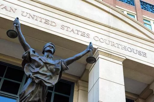 The U.S. Courthouse is seen in Alexandria, Va., Thursday, Sept. 2, 2021.   A woman who once lived in Kansas has been arrested after federal prosecutors charged her with joining the Islamic State group and leading an all-female battalion of AK-47 wielding militants. The U.S. Attorney in Alexandria, announced Saturday, Jan. 29, 2022, that 42-year-old Allison Fluke-Ekren has been charged with providing material support to a terrorist organization.  (AP Photo/Cliff Owen, File)