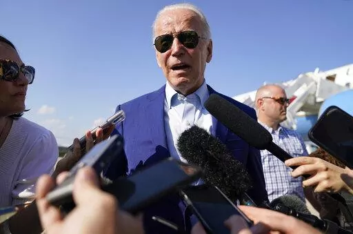 President Joe Biden speaks to members of the media after exiting Air Force One, Wednesday, July 20, 2022, at Andrews Air Force Base, Md. Biden has tested positive for COVID-19 on Thursday, July 21, making him the second U.S. president to get the virus and underscoring the extent to which the virus has infiltrated American society. (AP Photo/Evan Vucci, File)
