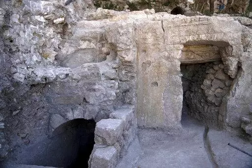 The site of a Jewish ritual bath or mikveh, left, discovered near the Western Wall in the Old City of Jerusalem, Sunday, July 17, 2022. An excavation to build an accessible elevator from the Jewish Quarter to the Western Wall near the Temple Mount by the Hebrew University of Jerusalem's Institute of Archaeology has unearthed the mikveh that dates back to the 1st Century CE. (AP Photo/Maya Alleruzzo)