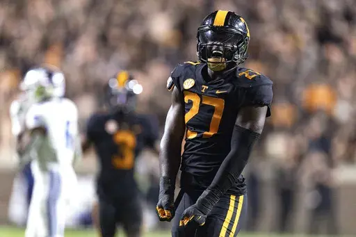 Tennessee defensive lineman James Pearce Jr. (27) reacts to making a sack during the second half of an NCAA college football game against Kentucky, Saturday, Nov. 2, 2024, in Knoxville, Tenn. (AP Photo/Wade Payne)