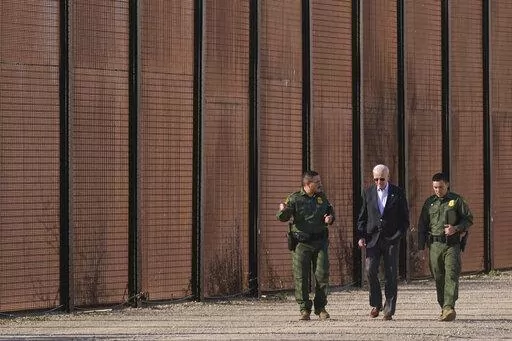 President Joe Biden walks with U.S. Border Patrol agents along a stretch of the U.S.-Mexico border in El Paso Texas, Sunday, Jan. 8, 2023. A new poll by The Associated Press-NORC Center for Public Affairs Research shows some support for changing the number of immigrants and asylum-seekers allowed into the country. About 4 in 10 U.S. adults say the level of immigration and asylum-seekers should be lowered, while about 2 in 10 say they should be higher, according to the poll. About a third want th