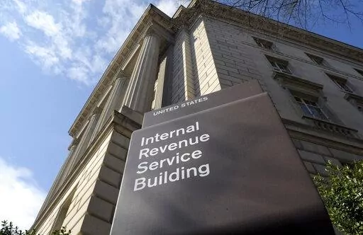 The exterior of the Internal Revenue Service (IRS) building in Washington, on March 22, 2013. One of Washington's favorite punching bags, the Internal Revenue Service, may finally get the resources it's been asking Congress for if Democrats get their economic package focused on energy and health care over the finish line. (AP Photo/Susan Walsh, File)
