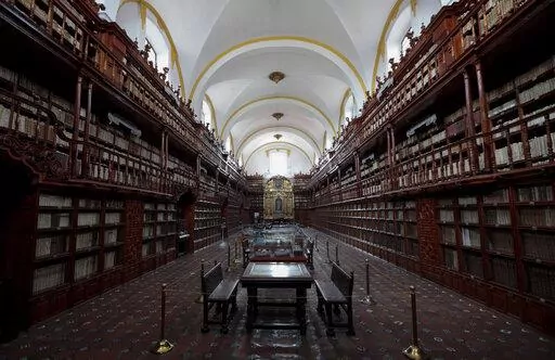The interior of Palafoxiana library in Puebla, Mexico, Tuesday, Sept. 13, 2022. It is the oldest public library in the Americas, according to UNESCO. (AP Photo/Pablo Spencer)