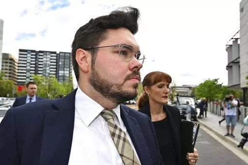 Former Liberal Party staff member Bruce Lehrmann arrives at the Australian Capital Territory Supreme Court in Canberra, Thursday, Oct. 27, 2022. A judge on Thursday discharged a jury in the high-profile trial of Lehrmann, a former government advisor, charged with raping a colleague in the Australian Parliament House because a juror had brought a research paper on sexual assaults into the jury room. (Mick Tsikas/AAP Image via AP)