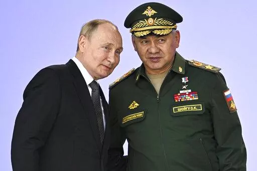 FILE Russia's President Vladimir Putin and Russian Defense Minister Sergei Shoigu attend the opening of the Army 2022 International Military and Technical Forum in the Patriot Park outside Moscow, Russia, Monday, Aug. 15, 2022. Putin has announced a partial mobilization in Russia as the fighting reaches nearly seven months. Putin's address to the nation on Wednesday, Sept. 21, 2022 comes a day after Russian-controlled regions in eastern and southern Ukraine announced plans to hold votes on becom