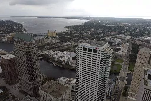 In this aerial image, the city of Tampa, Fla., is seen Monday, Sept. 26, 2022. Hurricane Ian was growing stronger as it barreled toward Cuba on a track to hit Florida's west coast as a major hurricane as early as Wednesday. It's been more than a century since a major storm like Ian has struck the Tampa Bay area, which blossomed from a few hundred thousand people in 1921 to more than 3 million today. (DroneBase via AP)