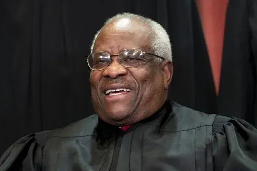 In this Nov. 30, 2018 photo, Supreme Court Associate Justice Clarence Thomas sits for a group portrait at the Supreme Court Building in Washington. Justice Thomas participated at a "fireside" chat in Salt Lake City hosted by former Sen. Orrin Hatch's foundation, Friday, March 11, 2022. (AP Photo/J. Scott Applewhite, File)